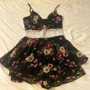 A pretty floral romper with a white design in the middle